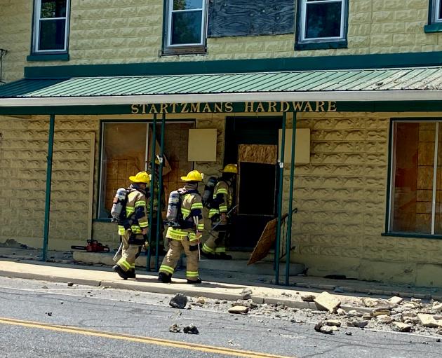 Part of former Hagerstown hardware store's facade collapses into street